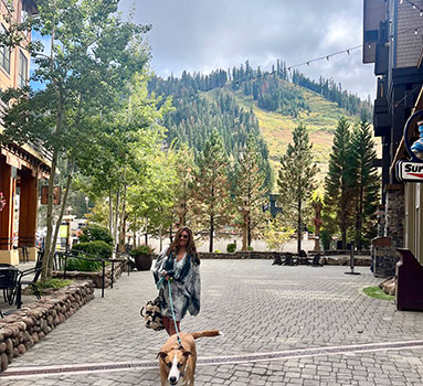 Photo of Julia Robinson walking with her dog